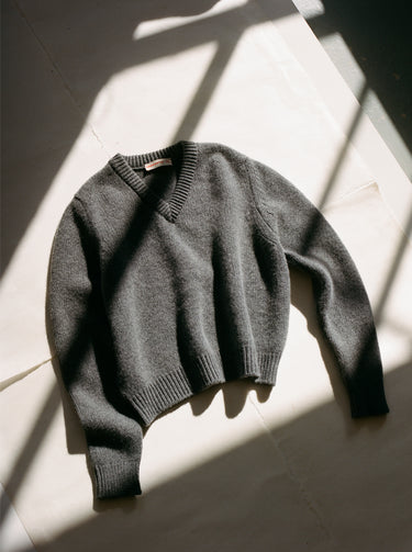 Grey V-neck knitted jumper